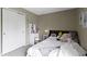 A cozy bedroom with a comfortable bed, soft lighting, and neutral tones creating a relaxing and inviting atmosphere at 10262 Carmine Dr, Noblesville, IN 46060