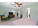 Well-lit bedroom with open doorways to ensuite bathrooms with a soft color pallet creating a smooth flow at 10262 Carmine Dr, Noblesville, IN 46060