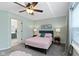 Cozy bedroom with soft lighting, a comfortable bed, and neutral tones creating a relaxing and peaceful atmosphere at 10262 Carmine Dr, Noblesville, IN 46060