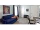 This bedroom is staged with a daybed, desk, and sliding closet featuring neutral carpet at 10262 Carmine Dr, Noblesville, IN 46060