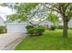 Charming home featuring a white garage door and landscaped front yard at 10262 Carmine Dr, Noblesville, IN 46060