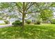 Well-maintained home with green lawn, mature trees and landscaping at 10262 Carmine Dr, Noblesville, IN 46060