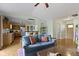 Open-concept living space with hardwood floors, fireplace and kitchen views at 10262 Carmine Dr, Noblesville, IN 46060