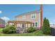 Well-manicured backyard with a pergola, built-in seating, and lush landscaping, ideal for outdoor enjoyment at 10806 Solis Cir, Fishers, IN 46038
