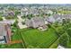 Aerial view of a home with a large, well-maintained lawn and patio in a suburban neighborhood at 10806 Solis Cir, Fishers, IN 46038