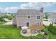 Aerial view of a well-maintained backyard featuring a patio, pergola, and a spacious lawn for outdoor activities at 10806 Solis Cir, Fishers, IN 46038