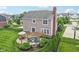 Aerial view of a home's backyard with patio, pergola, manicured lawn, ideal for outdoor entertaining and relaxation at 10806 Solis Cir, Fishers, IN 46038