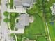 Aerial view of a home's backyard and patio featuring a well-maintained lawn and landscaping at 10806 Solis Cir, Fishers, IN 46038