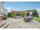Spacious backyard patio with a wooden pergola, outdoor seating, and a dining area perfect for entertaining guests at 10806 Solis Cir, Fishers, IN 46038
