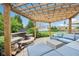 Charming backyard patio with a pergola, comfortable seating, a fire pit, and a relaxing outdoor space at 10806 Solis Cir, Fishers, IN 46038