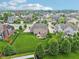 Aerial view of a home with a large, well-maintained lawn and patio in a suburban neighborhood at 10806 Solis Cir, Fishers, IN 46038