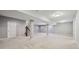 Expansive finished basement with neutral carpeting, support columns, and recessed lighting, perfect for flexible living at 10806 Solis Cir, Fishers, IN 46038
