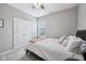 Bedroom with ceiling fan and double closet at 10806 Solis Cir, Fishers, IN 46038