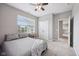 Cozy bedroom with natural light, neutral colors, and plush carpeting create a serene and inviting atmosphere at 10806 Solis Cir, Fishers, IN 46038