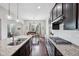 Open concept kitchen with stainless steel appliances, granite countertops, and access to the dining area at 10806 Solis Cir, Fishers, IN 46038