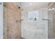 Bathroom shower with tile surround and glass door at 10806 Solis Cir, Fishers, IN 46038