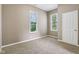 Bedroom featuring carpet, neutral paint, and windows at 1106 N Sheffield Ave, Indianapolis, IN 46222