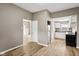 Bright kitchen features wood-look flooring, white cabinets, and stainless steel appliances at 1106 N Sheffield Ave, Indianapolis, IN 46222