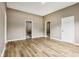 A view of the living room with hardwood floors and neutral walls, creating a warm and inviting atmosphere at 1106 N Sheffield Ave, Indianapolis, IN 46222