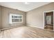 Inviting living room featuring hardwood floors, a window, and neutral tones for a cozy feel at 1106 N Sheffield Ave, Indianapolis, IN 46222