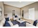 Cozy living room showcasing a neutral color palette and comfortable seating arrangement bathed in natural light at 1106 N Sheffield Ave, Indianapolis, IN 46222