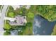 Stunning bird's-eye view of the property showcasing its backyard pond, professional landscaping, and neighborhood at 11761 Darsley Dr, Fishers, IN 46037