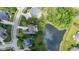 Overhead view of the property with a beautiful backyard including patio, landscaping, and pond at 11761 Darsley Dr, Fishers, IN 46037
