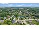 Aerial view of the property nestled in a serene neighborhood with a beautiful pond enhancing the landscape at 11761 Darsley Dr, Fishers, IN 46037