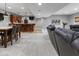Finished basement offering a bar, dining table, and seating at 11761 Darsley Dr, Fishers, IN 46037