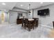 Basement dining area with seating for six, near the bar and entertainment area at 11761 Darsley Dr, Fishers, IN 46037