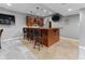 The basement bar is the perfect place for watching sports or entertaining guests at 11761 Darsley Dr, Fishers, IN 46037