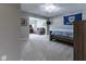 Comfortable bedroom with connecting living area, cozy furniture, and natural lighting at 11761 Darsley Dr, Fishers, IN 46037