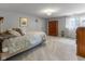 Cozy bedroom with plush carpeting, natural light from the window, and a wooden dresser at 11761 Darsley Dr, Fishers, IN 46037