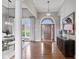 Spacious foyer boasts gleaming hardwood floors and natural light, creating an elegant entrance to the home at 11761 Darsley Dr, Fishers, IN 46037
