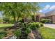 Landscaped front yard features a pond and waterfall, providing a tranquil and inviting entrance to the home at 11761 Darsley Dr, Fishers, IN 46037