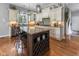 Gourmet kitchen with granite counters, an island with seating, and stainless steel appliances at 11761 Darsley Dr, Fishers, IN 46037