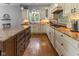 Bright kitchen featuring lots of counter space, stainless appliances and wood flooring at 11761 Darsley Dr, Fishers, IN 46037