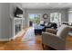 Inviting living room features a fireplace, hardwood floors, and sliding doors to an outdoor deck at 11761 Darsley Dr, Fishers, IN 46037