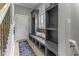 Convenient mudroom features custom shelving and a built-in bench with storage at 11761 Darsley Dr, Fishers, IN 46037