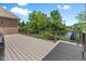 Spacious backyard deck offering picturesque views of the backyard, pond and mature trees at 11761 Darsley Dr, Fishers, IN 46037