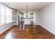Open dining area with hardwood floors and views of the kitchen, ideal for entertaining guests at 12820 Gloria Dr, Fishers, IN 46037
