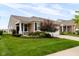 Charming home featuring beautiful landscaping, a welcoming front porch, and a well-maintained lawn at 12820 Gloria Dr, Fishers, IN 46037