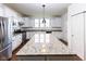Modern kitchen featuring granite countertops, stainless steel appliances, and white cabinetry at 12820 Gloria Dr, Fishers, IN 46037