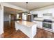 Bright kitchen with stainless steel appliances, granite counters, and a central island for cooking and gathering at 12820 Gloria Dr, Fishers, IN 46037