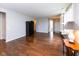 Bright living room featuring hardwood floors and an open floor plan with views of the foyer at 12820 Gloria Dr, Fishers, IN 46037