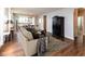 Cozy living room with hardwood floors, comfortable furnishings, and an open layout at 12820 Gloria Dr, Fishers, IN 46037
