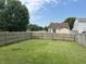 Fenced backyard featuring a well-manicured lawn, perfect for outdoor activities and relaxation at 1294 Kenwood Dr, Greenwood, IN 46143
