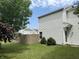 A fenced backyard showcasing a well-maintained lawn and the home's white siding at 1294 Kenwood Dr, Greenwood, IN 46143