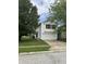 Two-story home with white siding, attached two-car garage, and well-maintained lawn at 1294 Kenwood Dr, Greenwood, IN 46143