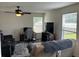 Inviting living room area featuring comfortable couches, a television, and plenty of natural light at 1294 Kenwood Dr, Greenwood, IN 46143